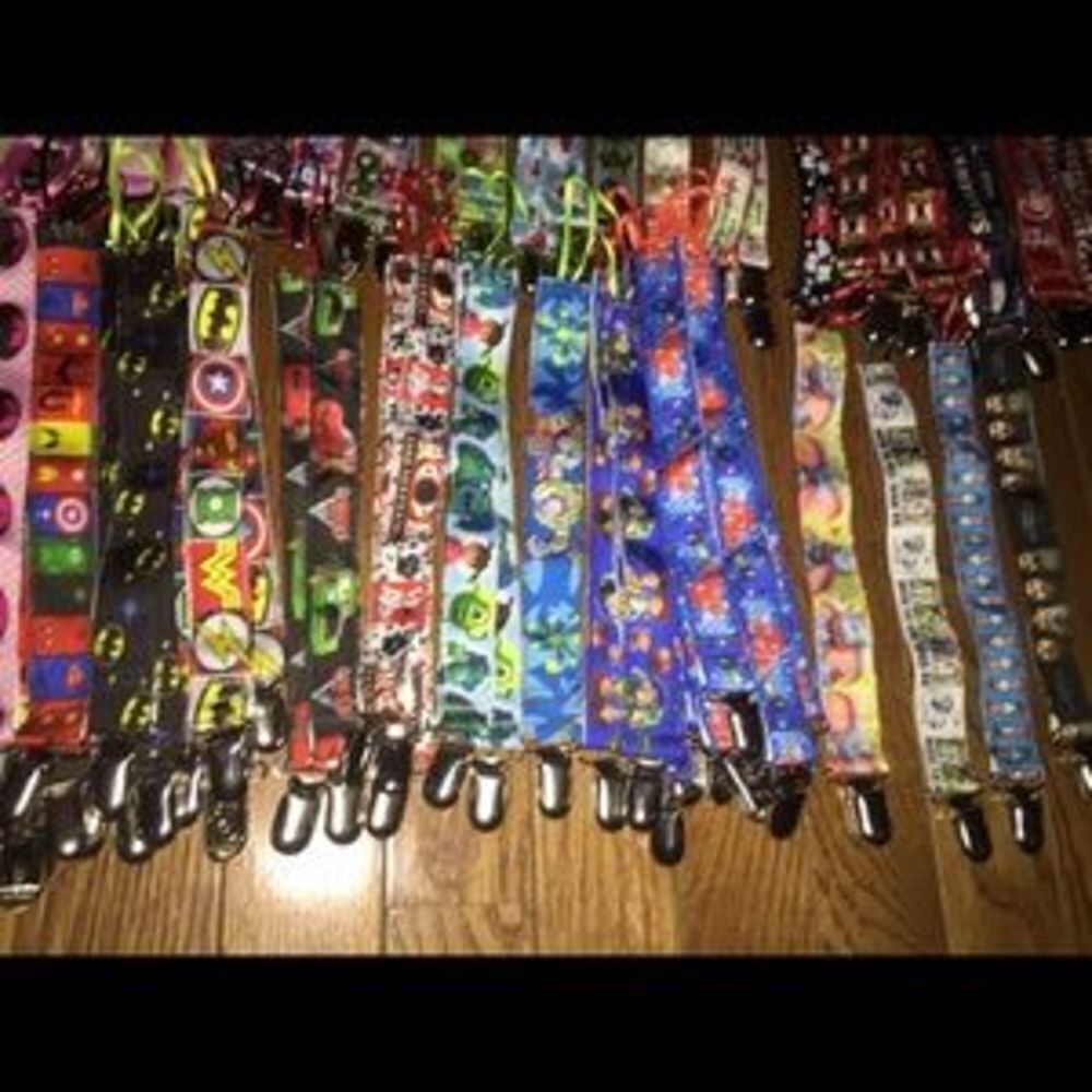 Pacifier clips with string ends. Home made.